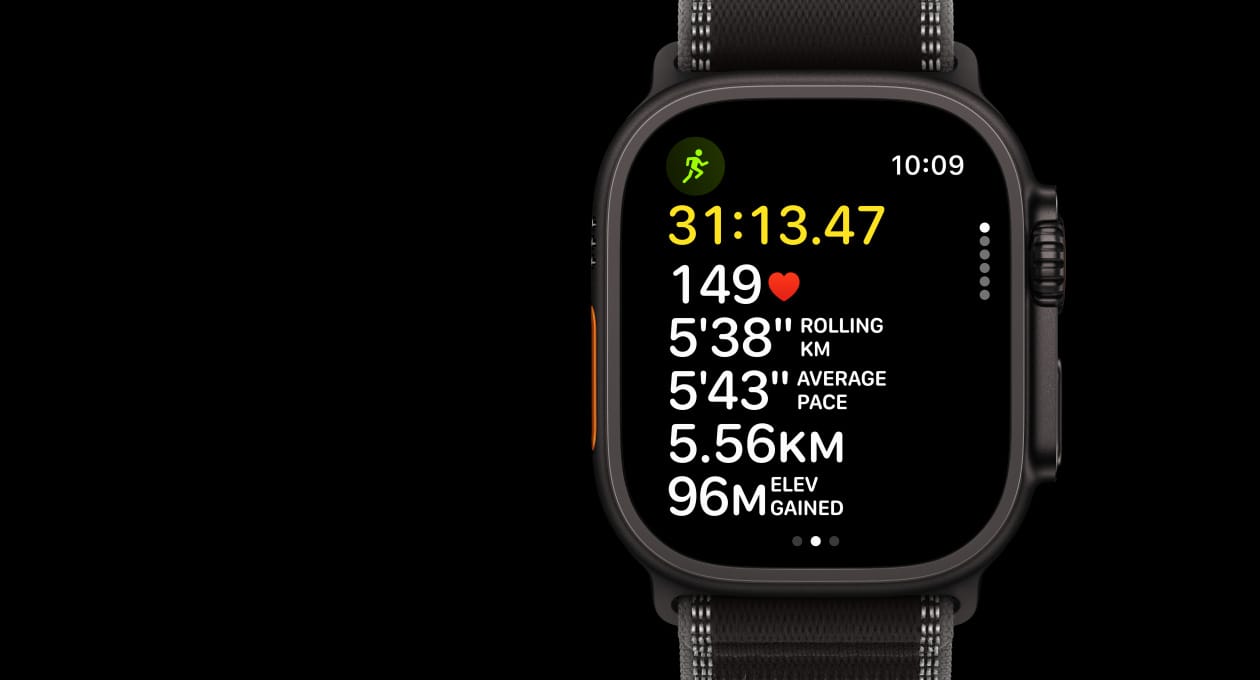 Apple Watch Ultra 3, black colour, titanium case, Workout app, Outdoor Run, left side exterior, Action button, right side exterior, Digital Crown, side button, strap, Trail Loop, black/charcoal colour