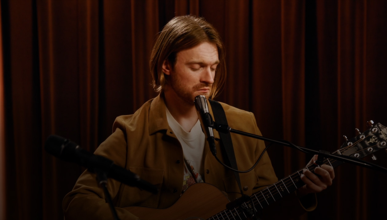 Kacey Musgraves and FINNEAS singing and playing guitar together