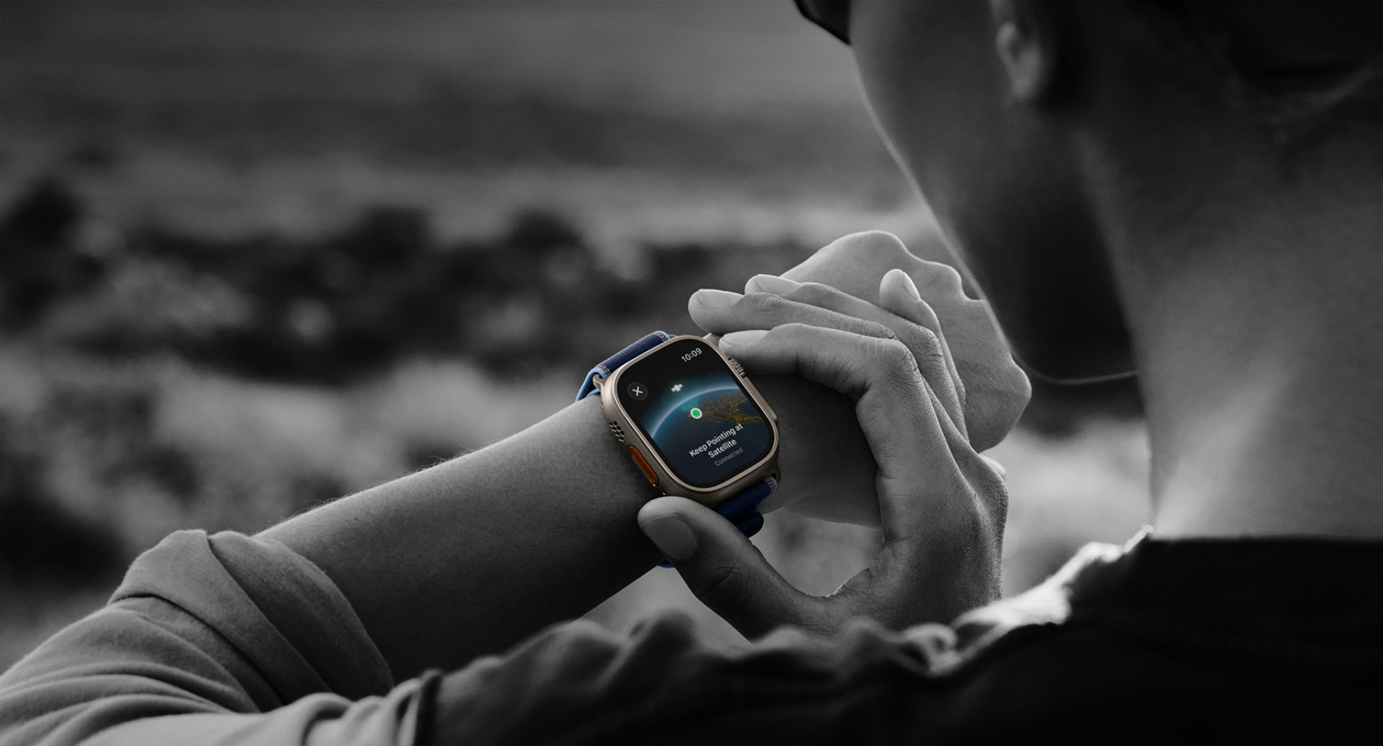 A person uses two-way satellite communication on Apple Watch Ultra 3 while hiking